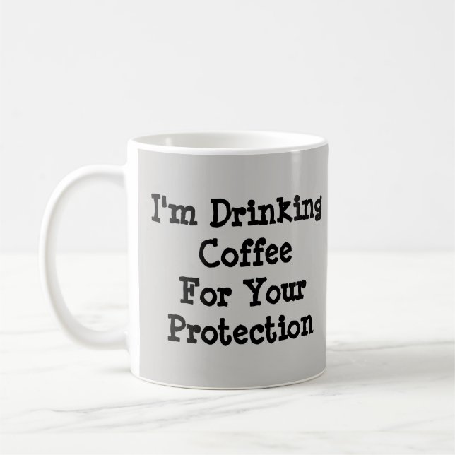 I'm Drinking Coffee For Your Protection  Mug (Left)