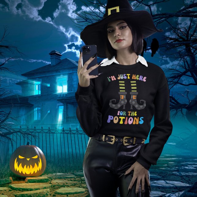 I'm Just Here For The Potions Cute Witch Halloween Sweatshirt (Shown in black. Multiple products, colors and sizes available. )