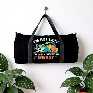 I'M NOT LAZY, I'M JUST CONSERVING ENERGY DUFFLE BAG