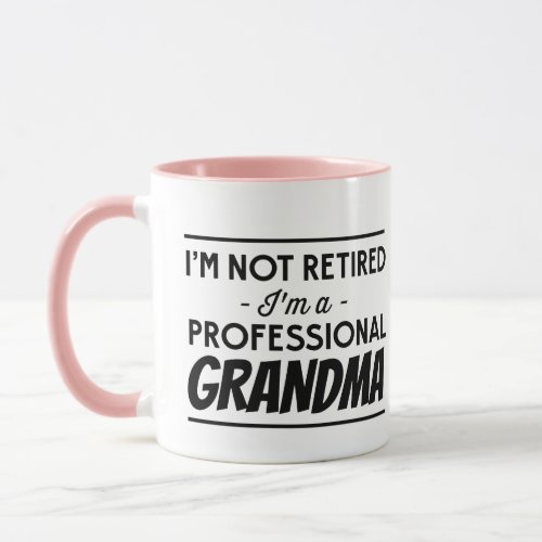 IM Not Retired Im A Professional Grandma Mug