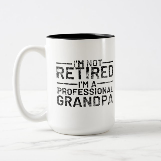 I'm Not Retired I'm A Professional Grandpa Two-Tone Coffee Mug (Left)