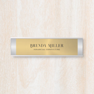 Image of a metallic gold background silver accent door sign