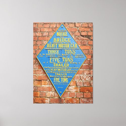 Image of Old blue metal warning sign on brick wall