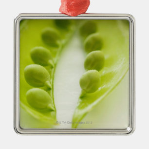 Image of three open pea pods, extreme close-up metal ornament