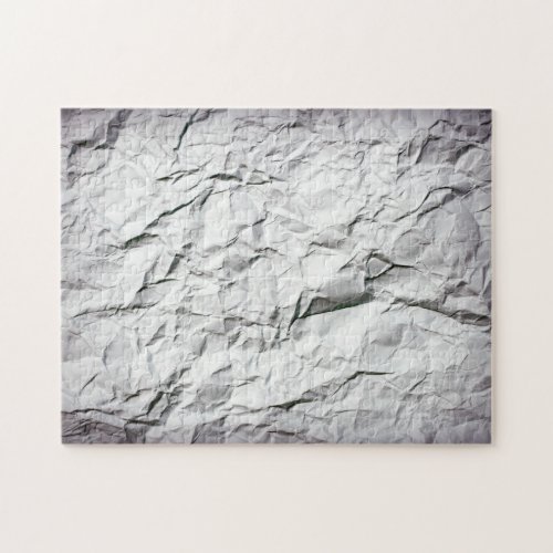 Impossible creased crumbled paper jigsaw puzzle