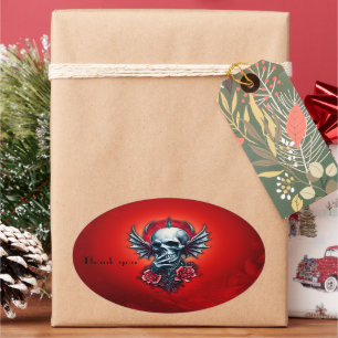 Impressive, realistic skull with wings oval sticker