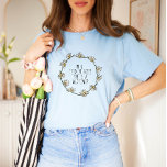 In a Field of Roses, She is a Wildflower T-Shirt<br><div class="desc">This design with the quote "In a field of roses, she is a wildflower" and a lovely daisy wreath is the perfect way to celebrate your uniqueness and embrace your individuality. The beautiful daisy wreath illustration, with the quote "In a field of roses, she is a wildflower" reminds you that...</div>