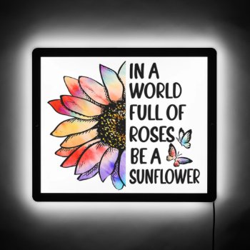 In A World Full Of Roses Be A Sunflower Led Sign by malibuitalian at Zazzle