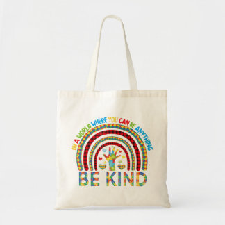 In a world where you can be anything kindness rain tote bag