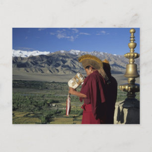 India, Ladakh, Thikse. Buddhist monk blows Postcard