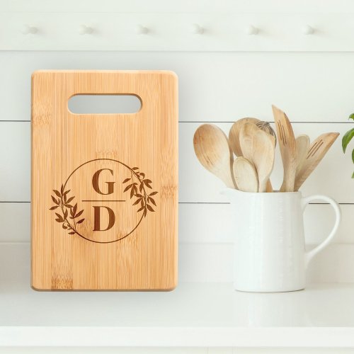 Initials and branch with leaves vertical wedding cutting board