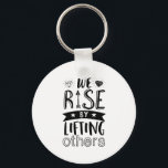 Inspirational Kind Quote We Rise By Lifting Others Keychain<br><div class="desc">Inspirational motivation quote to keep you inspired and motivate others around you.

Beautiful saying about being kind and supporting each other. We rise by lifting others.

Background color can be customized to your desired color.</div>