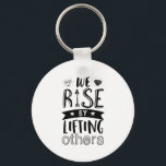 Inspirational Kind Quote We Rise By Lifting Others Keychain<br><div class="desc">Inspirational motivation quote to keep you inspired and motivate others around you.

Beautiful saying about being kind and supporting each other. We rise by lifting others.

Background color can be customized to your desired color.</div>