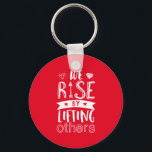 Inspirational Quote We Rise By Lifting Others Keychain<br><div class="desc">Inspirational motivation quote to keep you inspired and motivate others around you.

Beautiful saying about being kind,  supportive and helping each other. We rise by lifting others.

Background color can be customized to your desired color.</div>