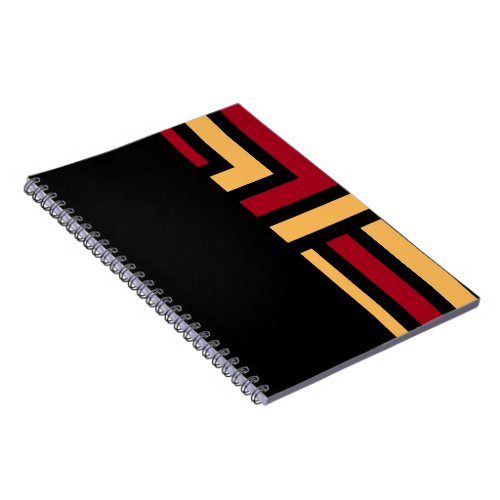 inspire and create in black and red notebook