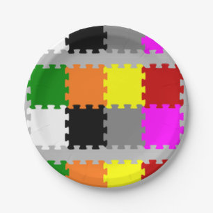 Interlocking puzzle pieces on grey paper plates