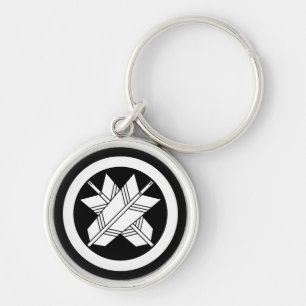 Intersecting arrows in circle keychain