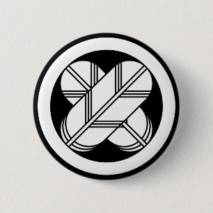 Intersecting hawk feathers in circle button