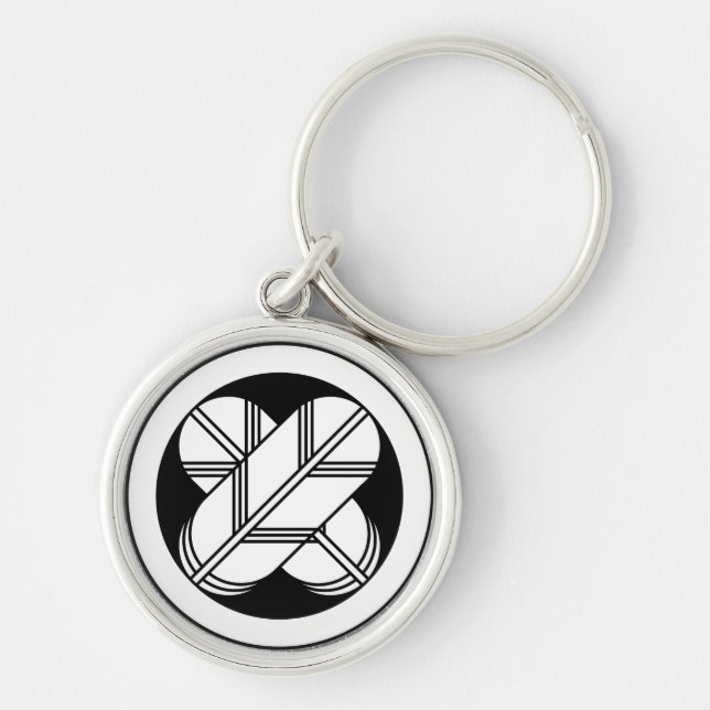 Intersecting hawk feathers in circle keychain (Front)
