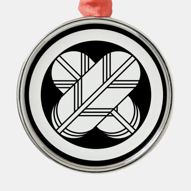 Intersecting hawk feathers in circle metal ornament (Front)