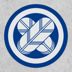 Intersecting hawk feathers in circle patch