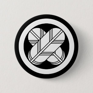 Intersecting hawk feathers in circle pinback button