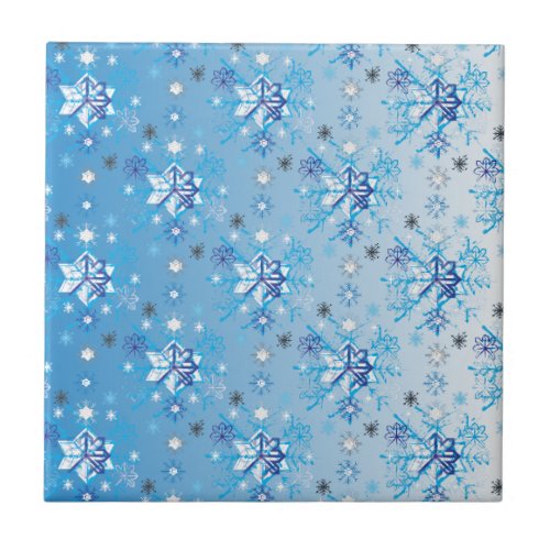 Intricate blue and white stars and snowflakes ceramic tile