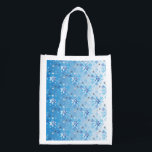 Intricate blue and white stars and snowflakes grocery bag<br><div class="desc">Intricate blue and white stars and snowflakes holiday pattern. Need more? Check out other holiday designs at my store! Cheers! :)</div>