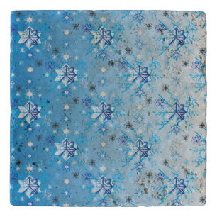 Intricate blue and white stars and snowflakes trivet