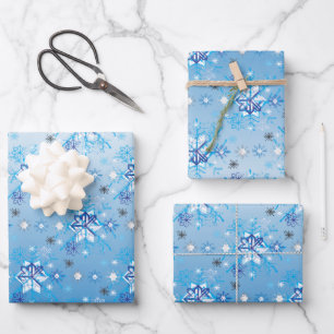 Intricate blue and white stars and snowflakes wrapping paper sheets