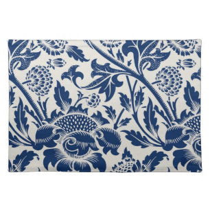 Intricate blue floral pattern on light background cloth placemat