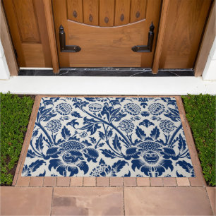 Intricate blue floral pattern on light background doormat