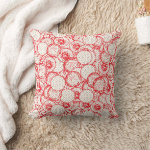 Intricate textile design featuring red, gold, and  throw pillow