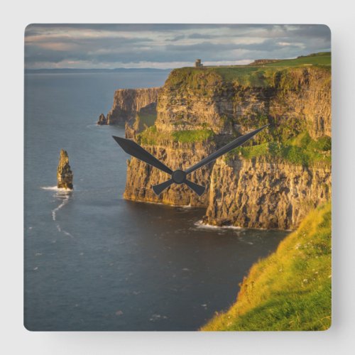 Ireland coastline at sunset square wall clock