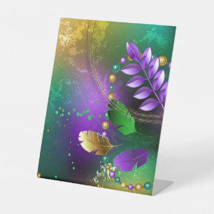Iridescent mardi gras background with beads pedestal sign