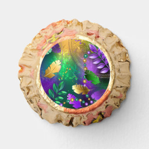 Iridescent mardi gras background with beads reese's peanut butter cups