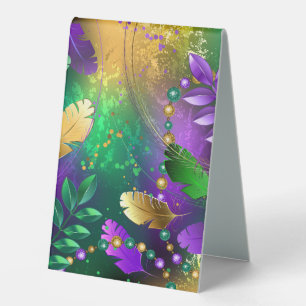 Iridescent mardi gras background with beads table tent