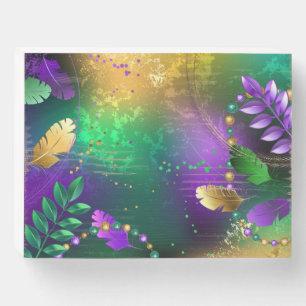 Iridescent mardi gras background with beads wooden box sign