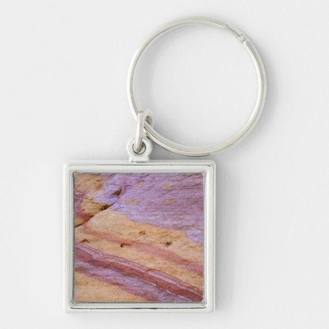 Iron oxides color a sandstone formation keychain (Front)