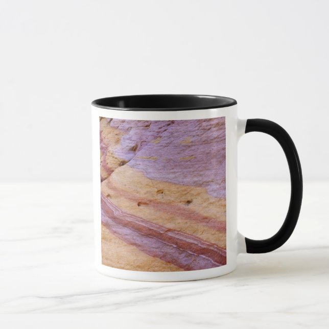Iron oxides color a sandstone formation mug (Right)