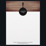 Iron Skillet Rustic Wood Restaurant Catering Food Letterhead<br><div class="desc">Illustration of iron skillet silhouette at top over a rustic wood background.  Personalize the white text on skillet.  Custom black text at bottom for contact info.</div>