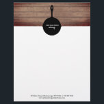 Iron Skillet Rustic Wood Restaurant Catering Food Letterhead<br><div class="desc">Illustration of iron skillet silhouette at top over a rustic wood background.  Personalize the white text on skillet.  Custom black text at bottom for contact info.</div>