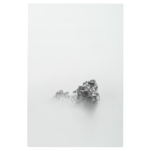 Isolated rock in a mist of sea metal print