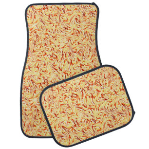 It looks like a halved cabbage, yellow and coral car floor mat