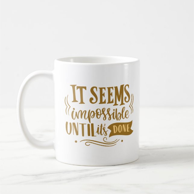 it seems impossible until it's done coffee mug (Left)