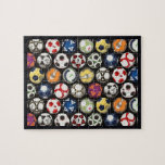 It Takes Balls to Play Soccer Jigsaw Puzzle<br><div class="desc">16” x 20” jigsaw puzzle of an assortment of colorful soccer balls in front of a soccer goal net on black. Black border. Includes gift box with image printed on lid. See the entire Father’s Day Puzzle collection in the ACTIVITIES | Puzzles section.</div>