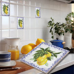 Italian Lemons Blue Filigree European Ceramic Tile<br><div class="desc">Introducing our delightful European-inspired ceramic tiles, available in two dimensions: 4.25x4.25 inches and 6x6 inches. These exquisite tiles feature vibrant lemon motifs nestled amidst abundant, verdant foliage, elegantly encircled by an opulent navy blue toile filigree border. Embark on a journey to the picturesque landscapes of Italy or the charming French...</div>