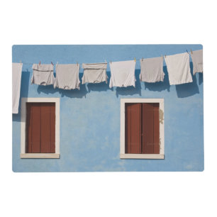 Italy, Burano. Hanging laundry and windows along Placemat
