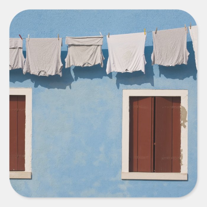 Italy, Burano. Hanging laundry and windows along Stickers