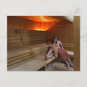 Italy, Tuscany, Young couple relaxing in sauna Postcard